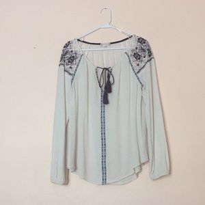 Off white boho shirt with purple detail.